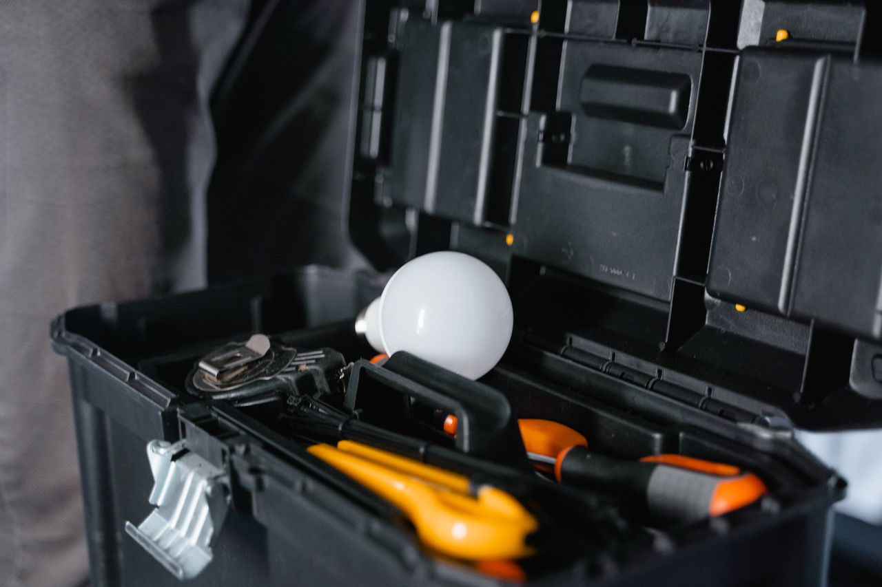 The Art of Drawing Readers In: Your attractive post title goes here Open toolbox containing various tools and a light bulb.
